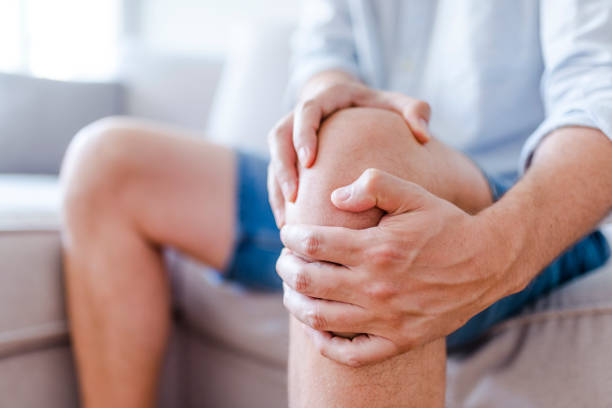 What are the common causes that lead to the need for knee replacement?